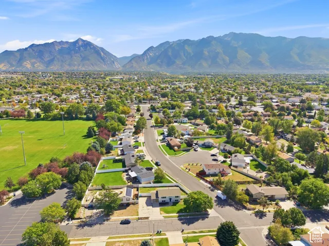 Mountain backdrop, residential area, parkland, paved roads, established trees