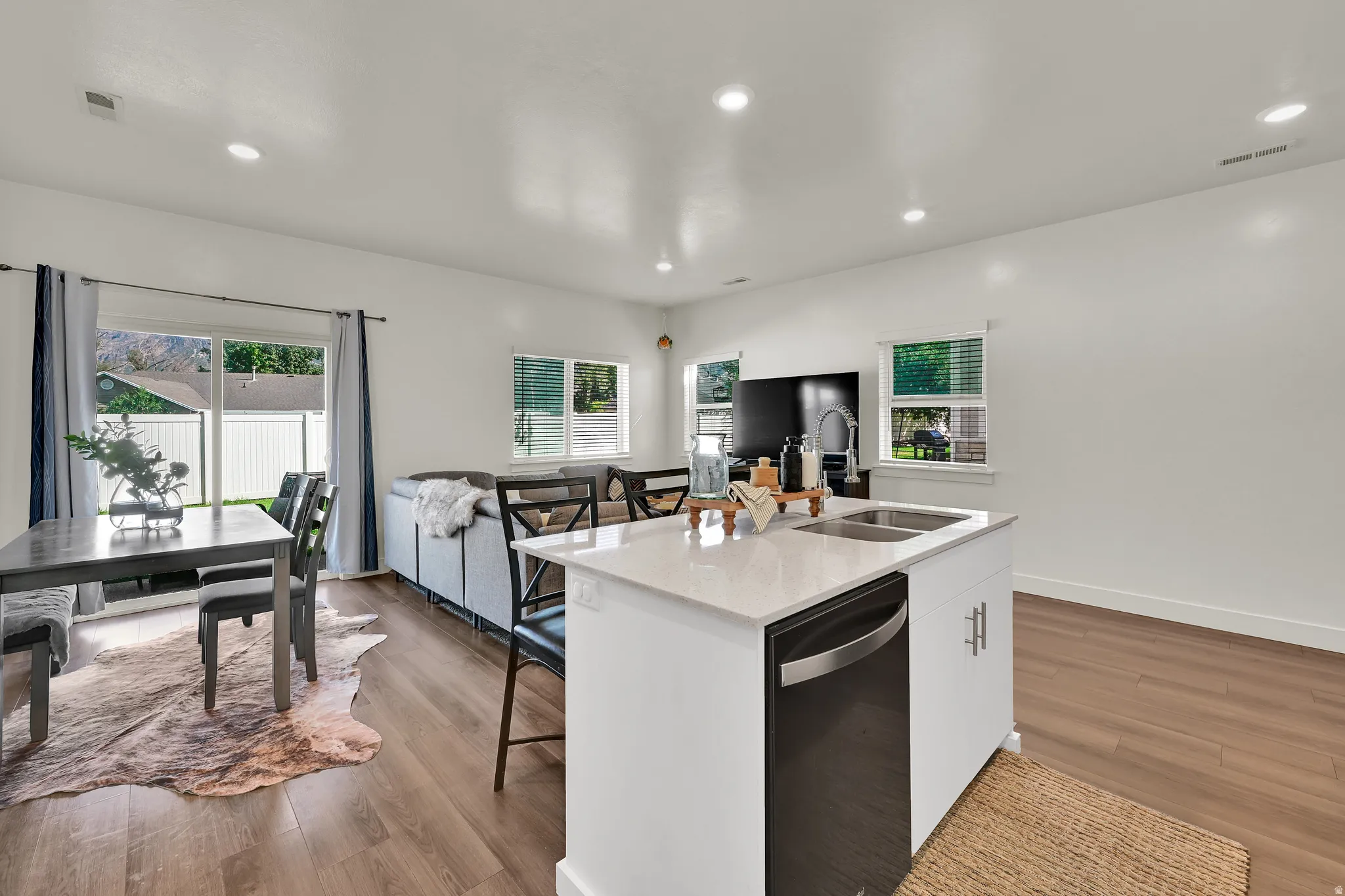 Open-concept living area with wood like LVP flooring