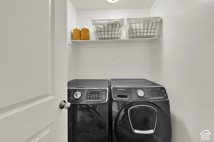 Dedicated laundry area with a white built-in shelf. Located on the same floor as the bedrooms for convenience