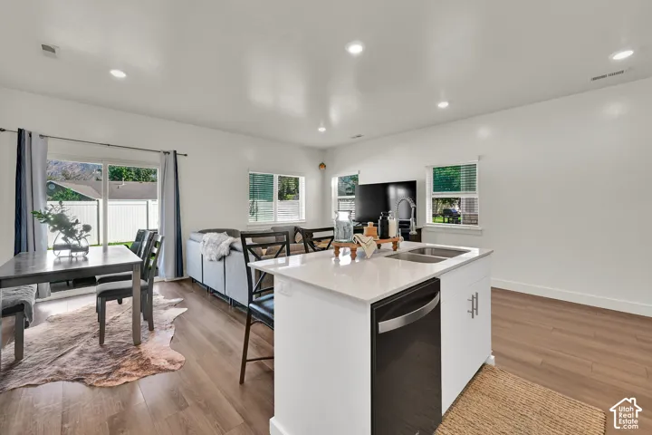 Open-concept living area with wood like LVP flooring