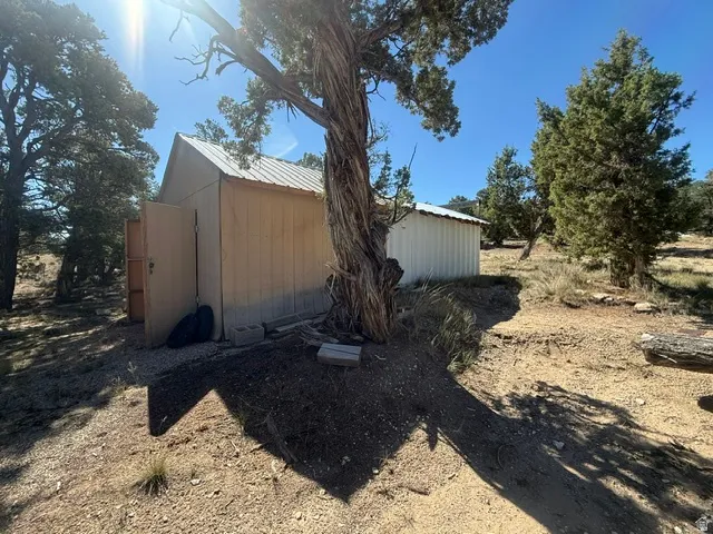 Metal-sided accessory building with a pitched metal roof