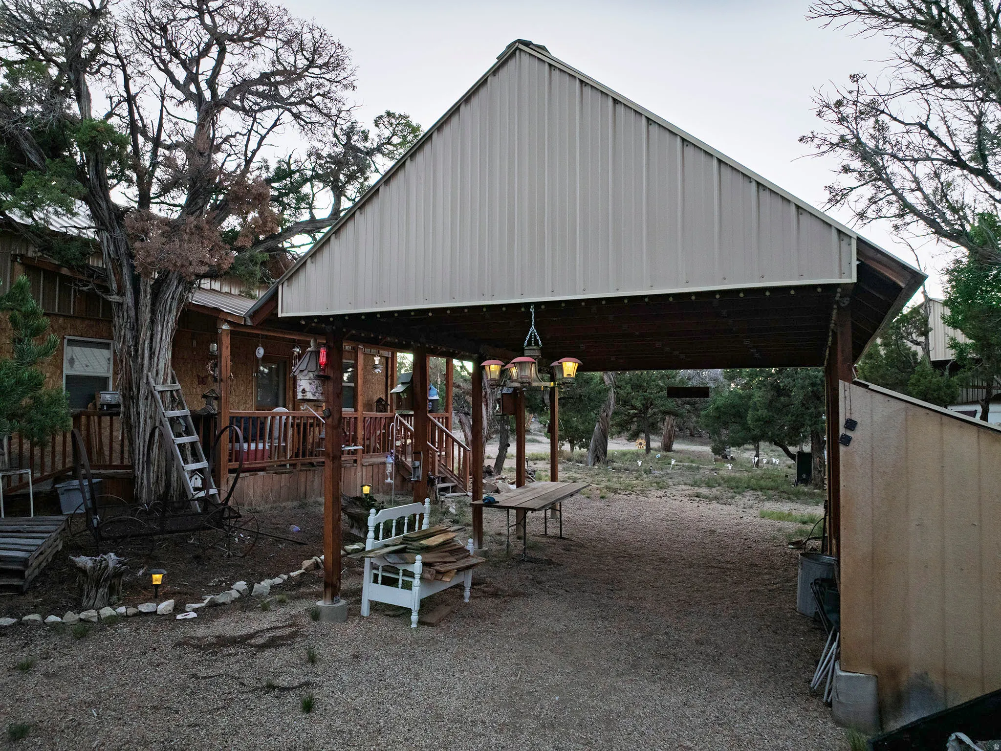 Wood-sided exterior with a covered porch and railing