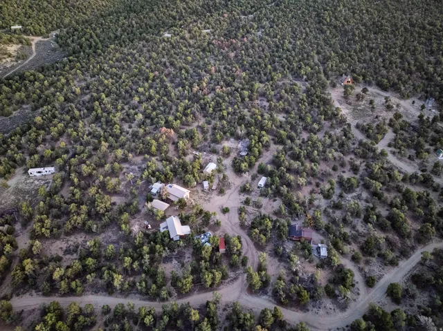 Expansive, wooded terrain with multiple structures
