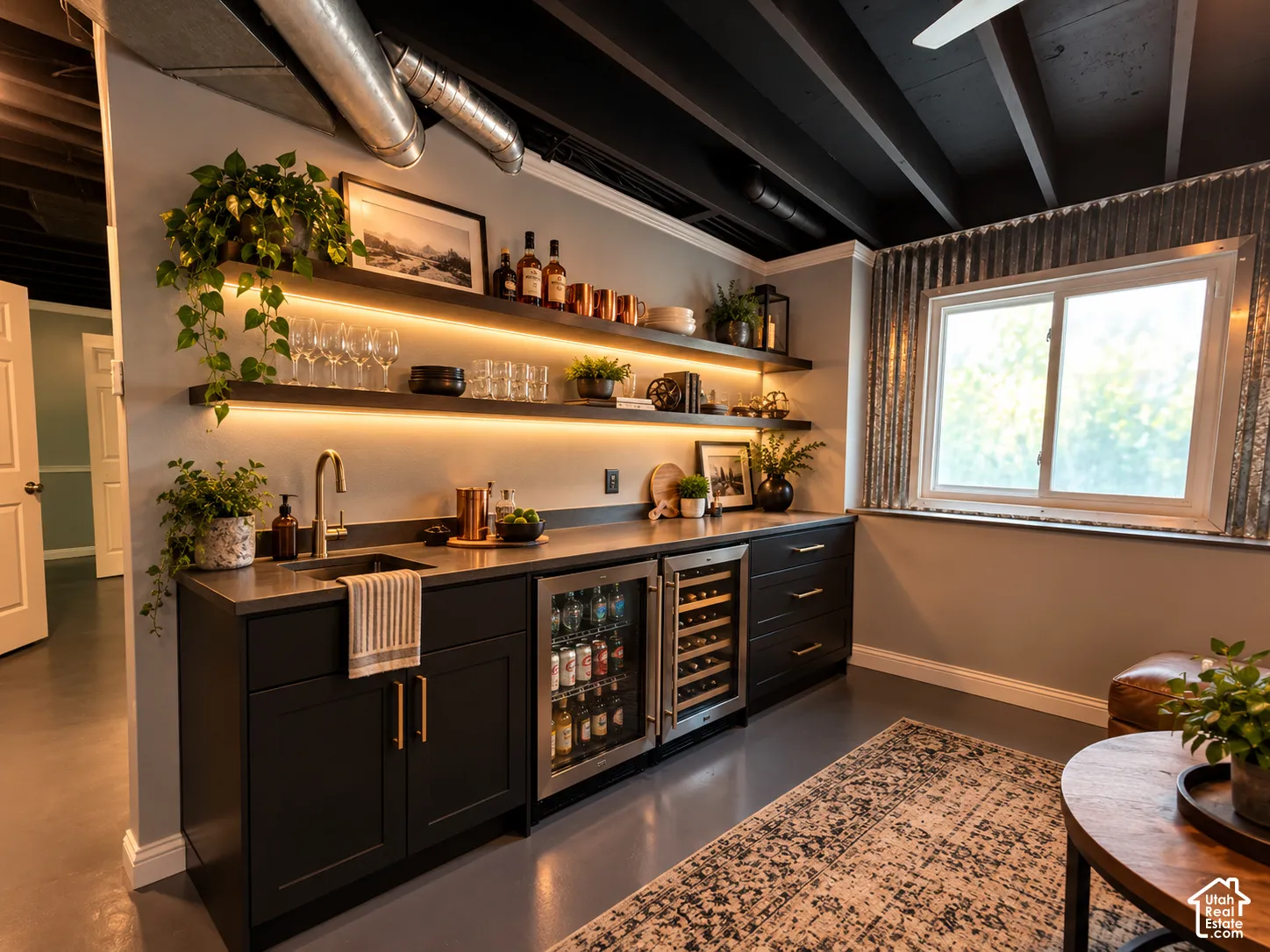 Current back of hobby room includes sink- picture virtually staged to show back of family room with sink area transformed into wet bar area.