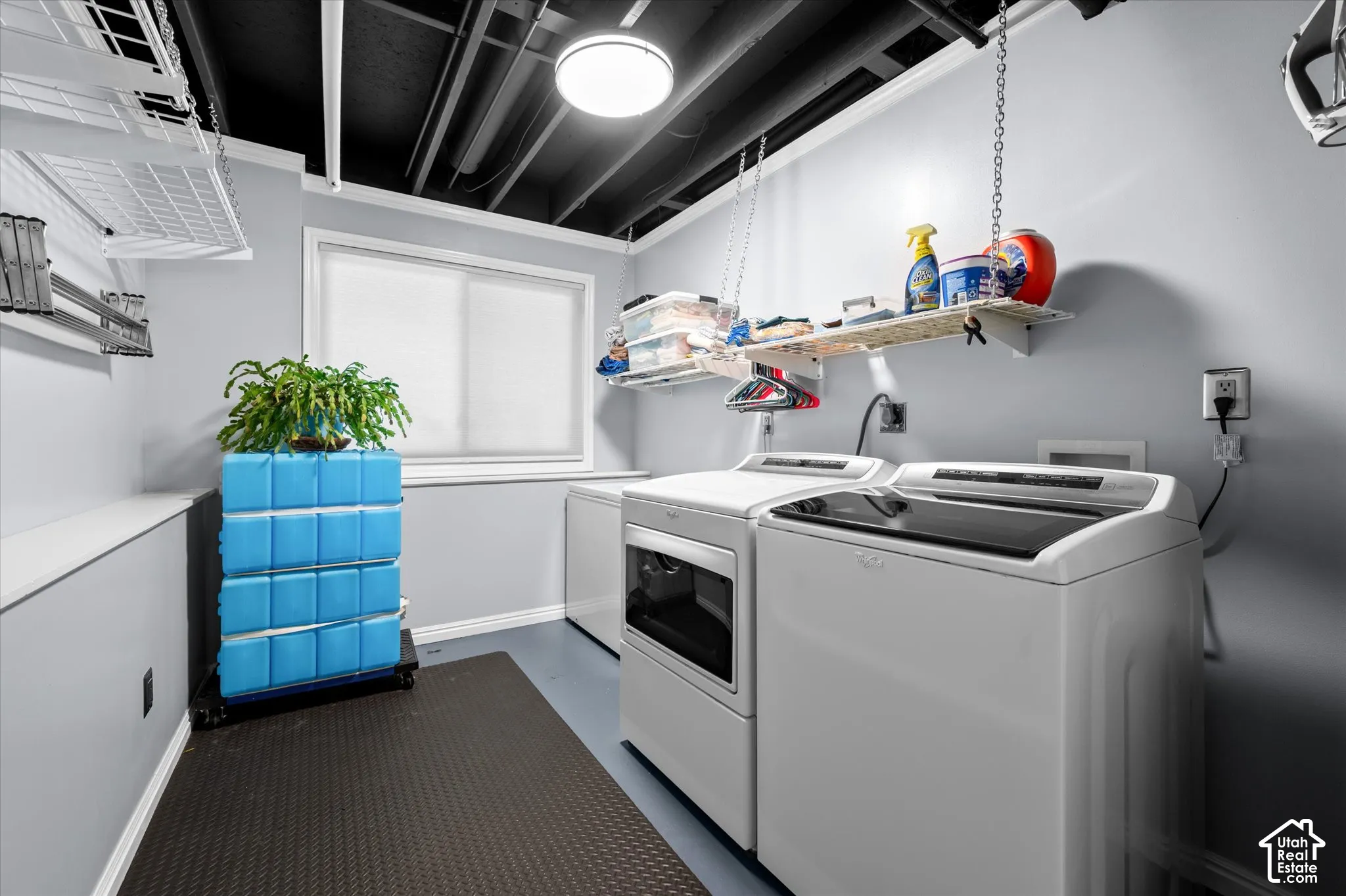 Dedicated laundry area featuring a window, overhead lighting, and utility hookups