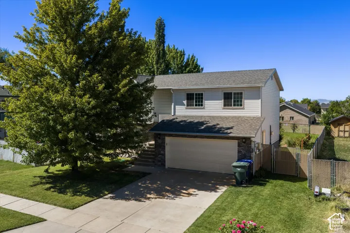 Mature trees, brick and vinyl exterior, split entry home