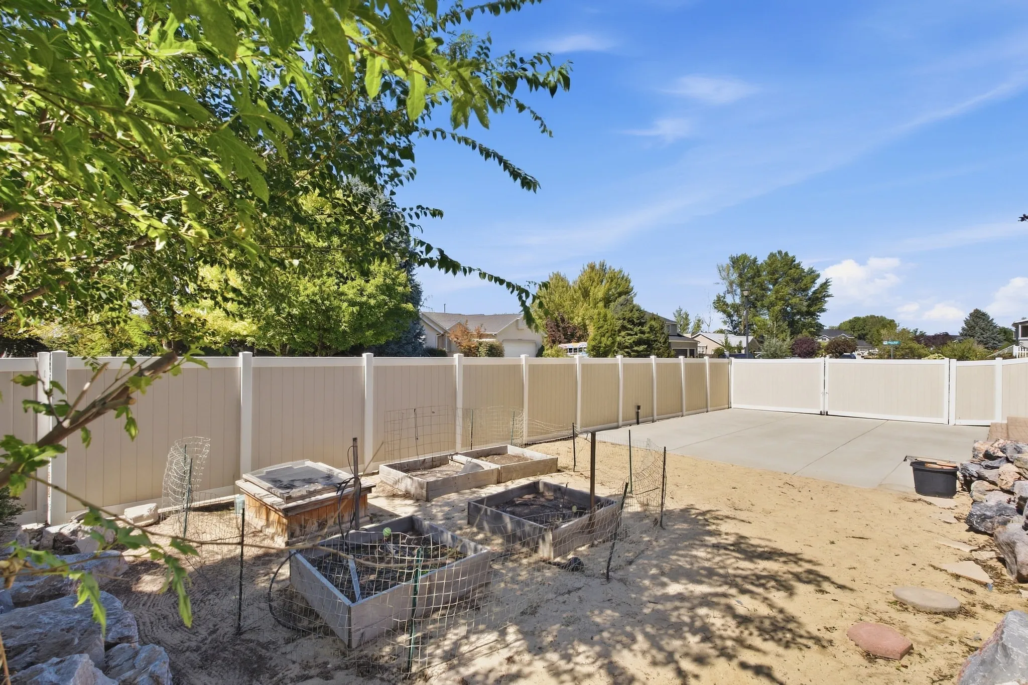 Five garden boxes connected to sprinkler system with their own watering station.