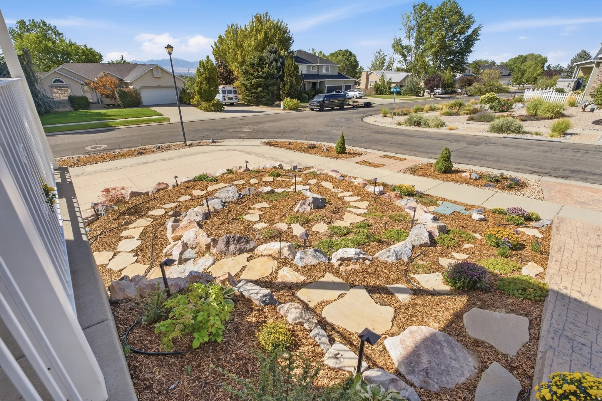 Artistic xeriscaped yard with beautiful rock spiral and drip system.