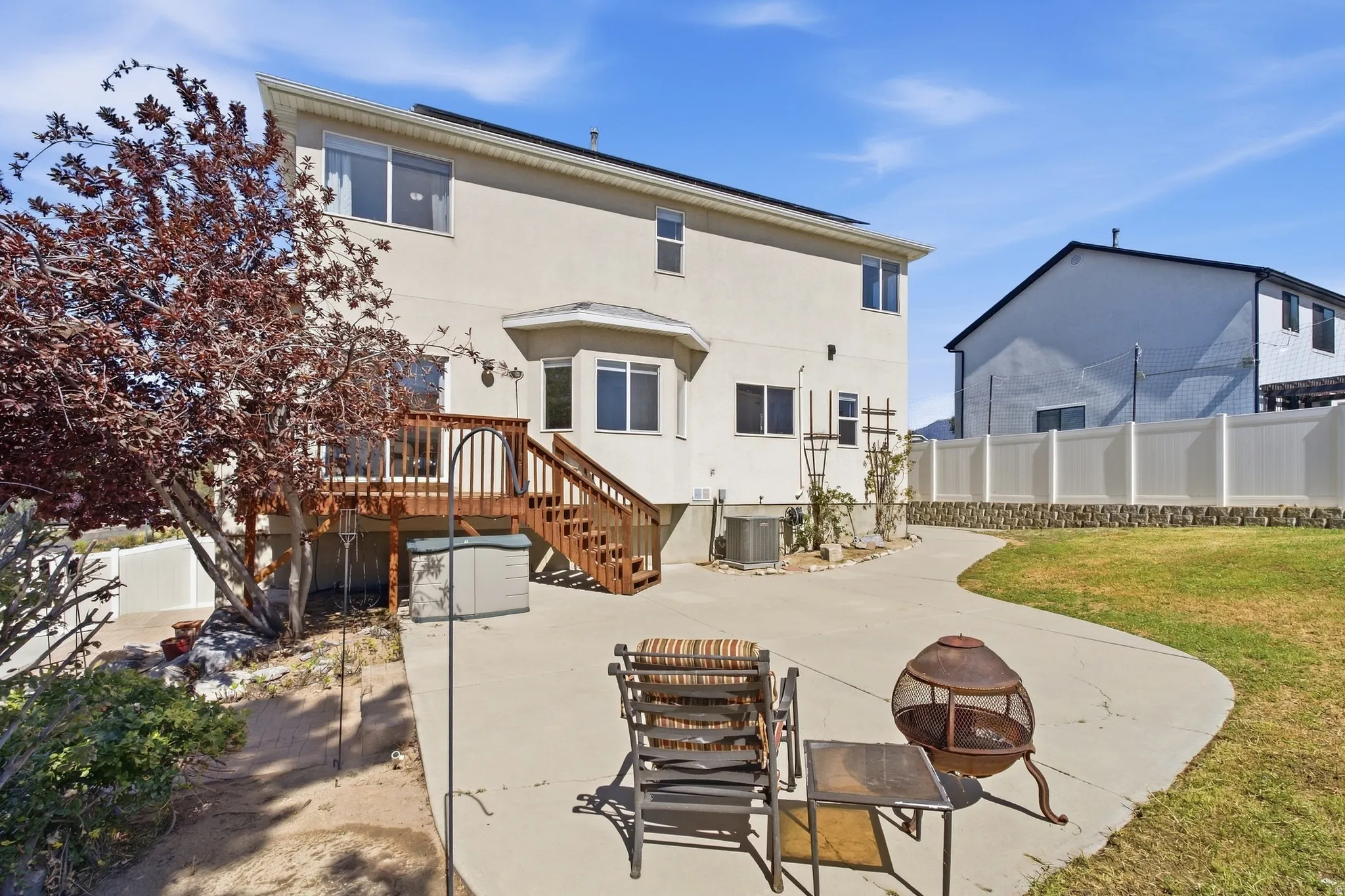 Back wood deck leading to backyard with plenty of room to entertain, play with your kids or just relax.