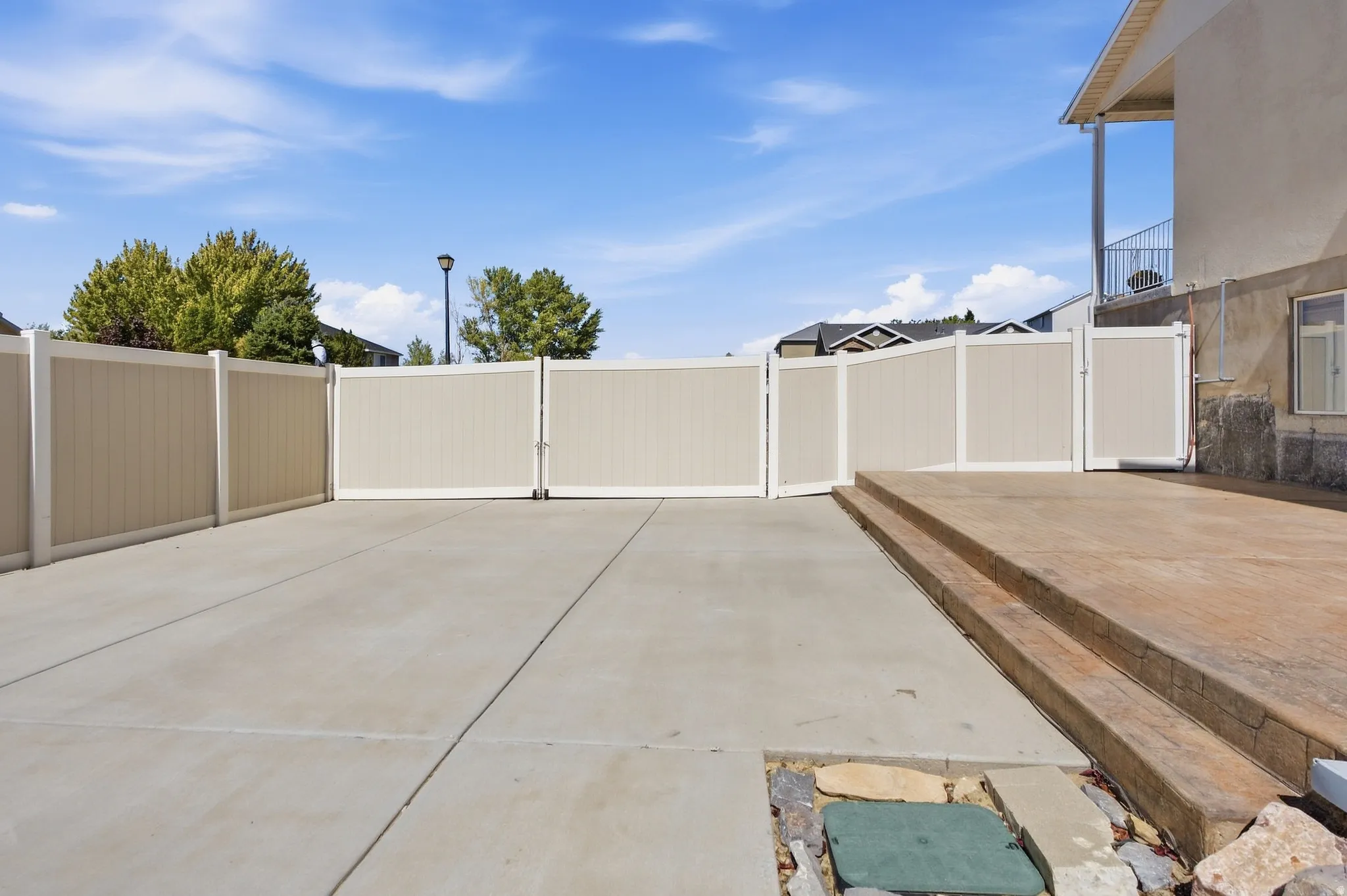 Fully fenced and huge gate opening up to RV parking, a space for a boat, ATVs or use it for a sports court or family parties. Colored and stamped concrete, extra electrical outlets and access to brand new solar inverter.