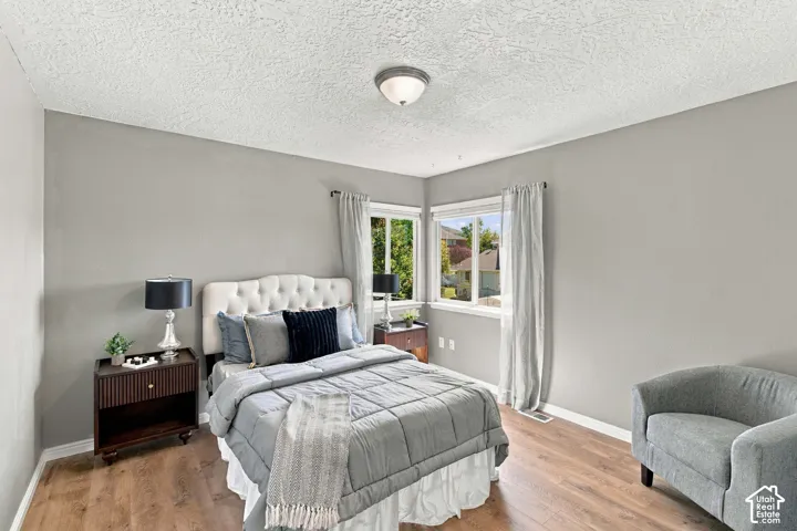 Second bedroom with corner windows overlooking the backyard with big walk in closet.