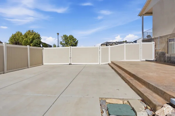 Fully fenced and huge gate opening up to RV parking, a space for a boat, ATVs or use it for a sports court or family parties. Colored and stamped concrete, extra electrical outlets and access to brand new solar inverter.