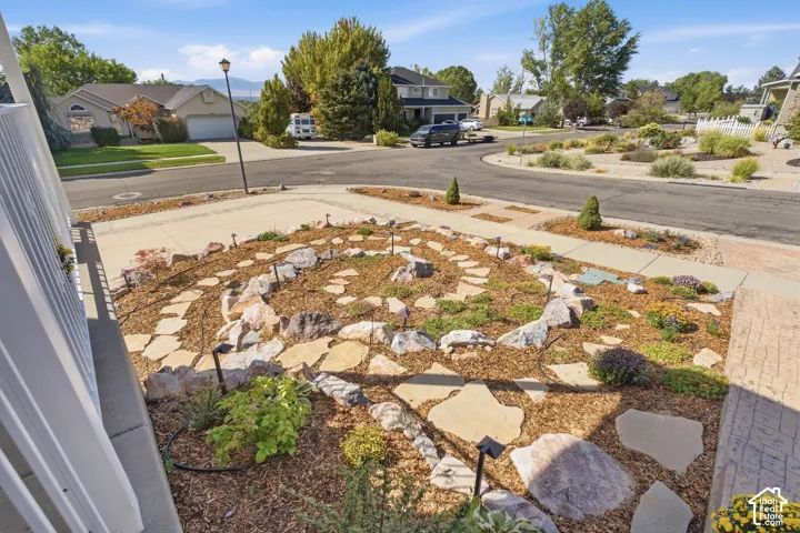 Artistic xeriscaped yard with beautiful rock spiral and drip system.