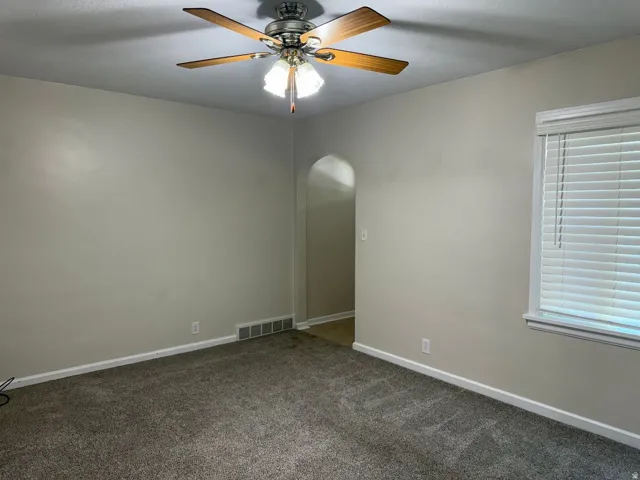 Neutral-toned walls complement plush carpeting
