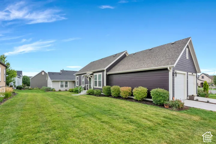 Expansive front lawn with manicured landscaping