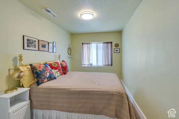 Window with privacy drapes, built-in ceiling light, and white trim