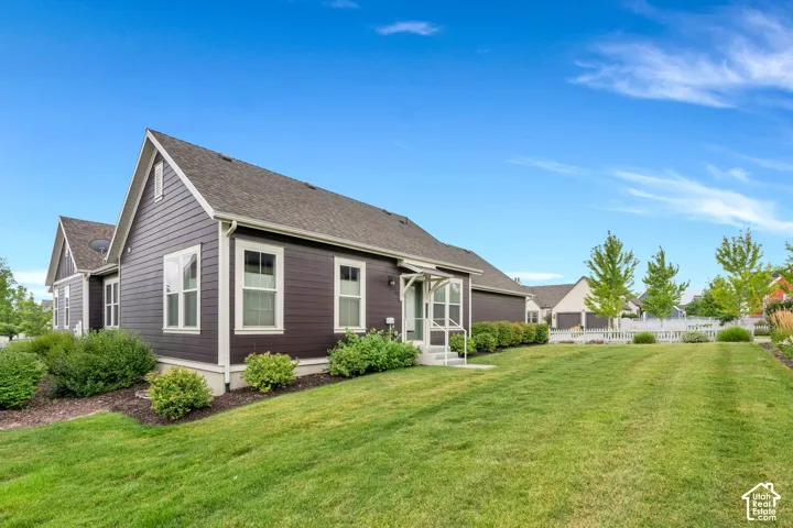 Dark horizontal siding exterior with white trim