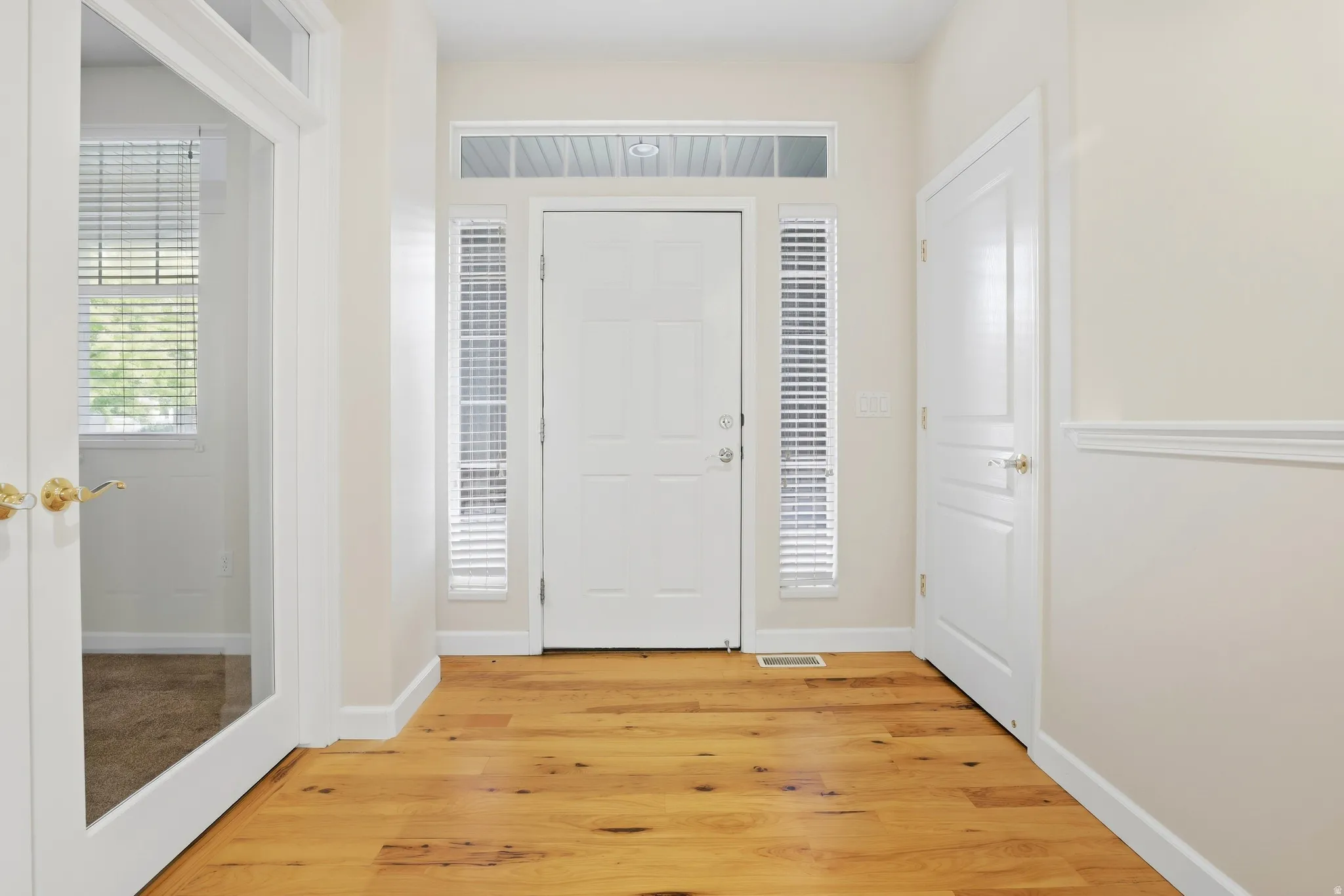 Wood-finish flooring with white trim