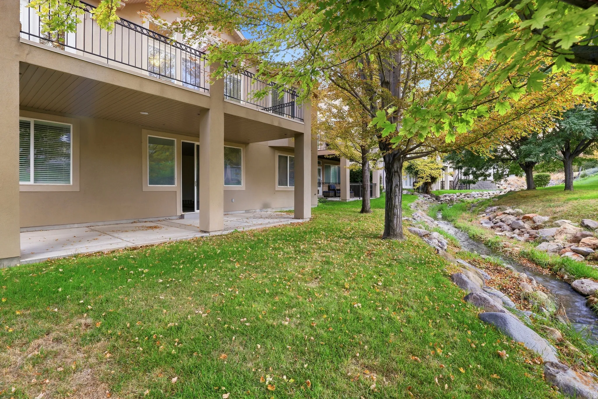 Ground-level patio with sliding glass door access