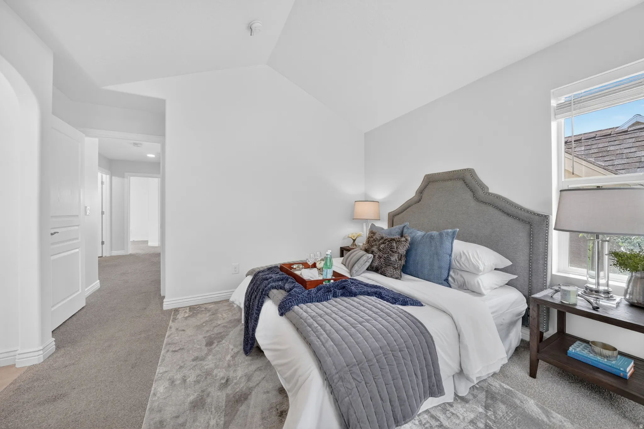 Recessed lighting, carpet flooring, window with blinds, and white interior doors