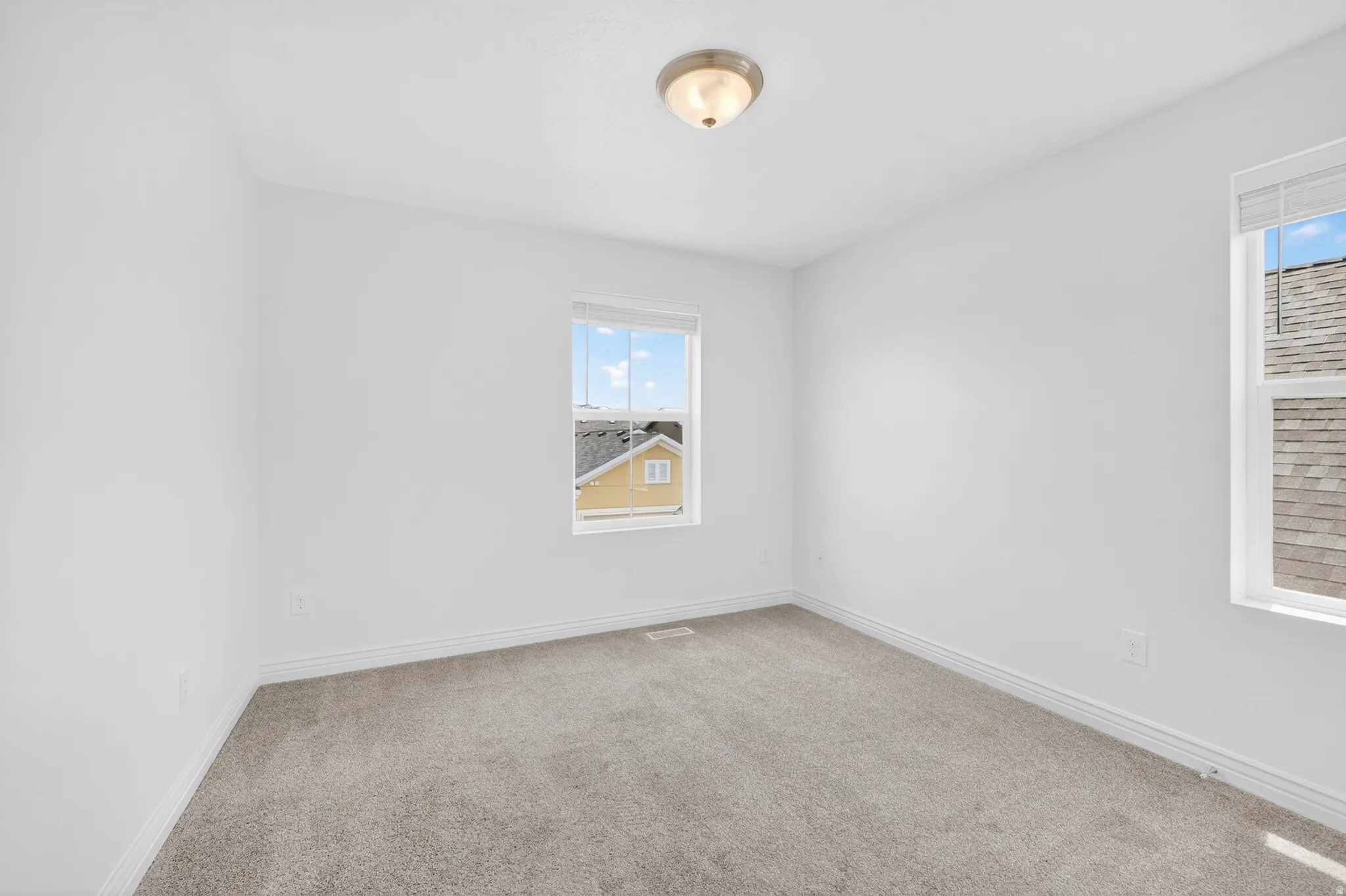 Neutral-toned carpeting throughout
