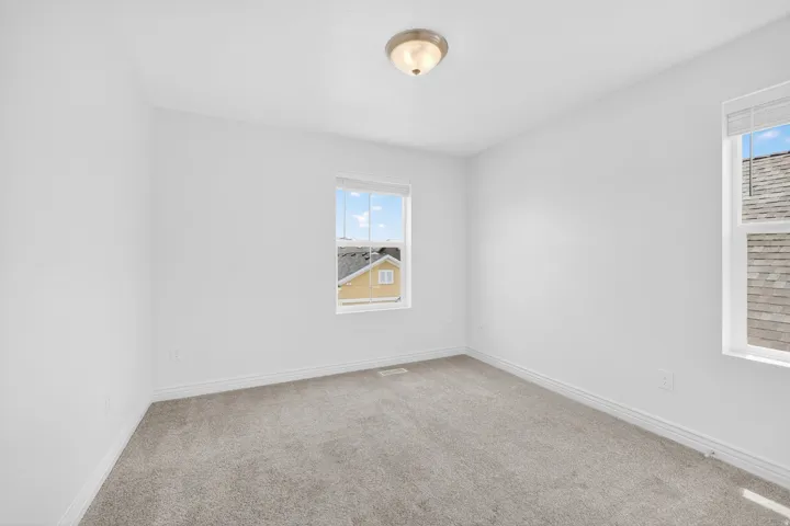 Neutral-toned carpeting throughout