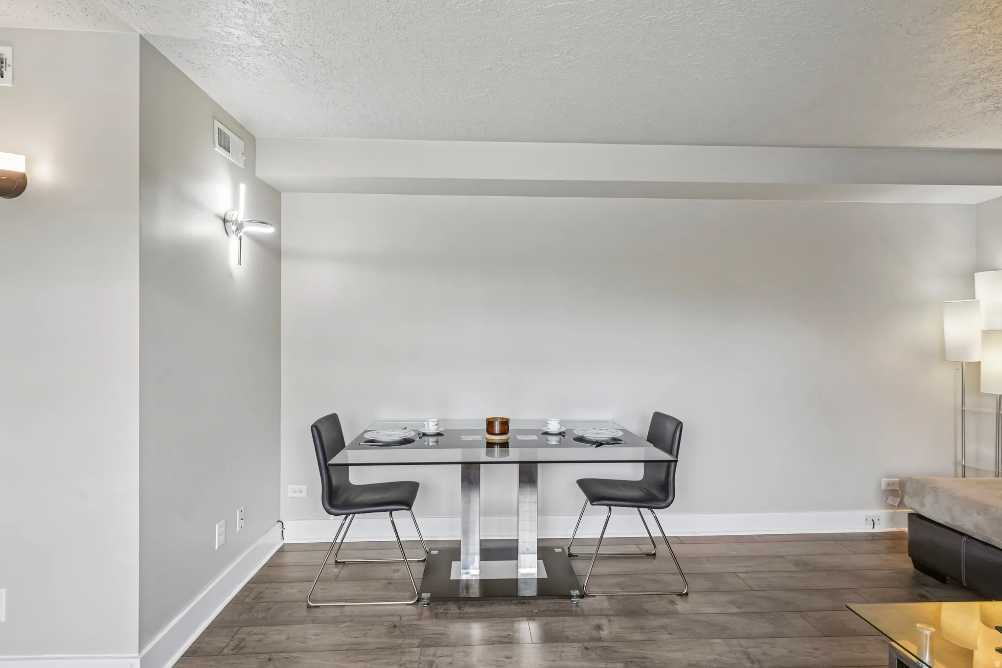 Wood-finish flooring with crisp white baseboards