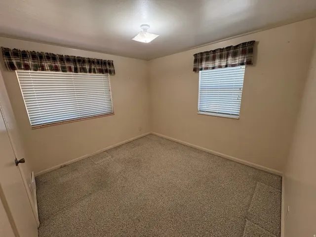 Wall-to-wall carpeting and neutral wall tones