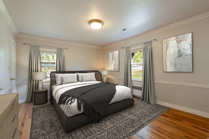 Hardwood flooring, crown molding, chair rail molding, and a flush mount ceiling fixture