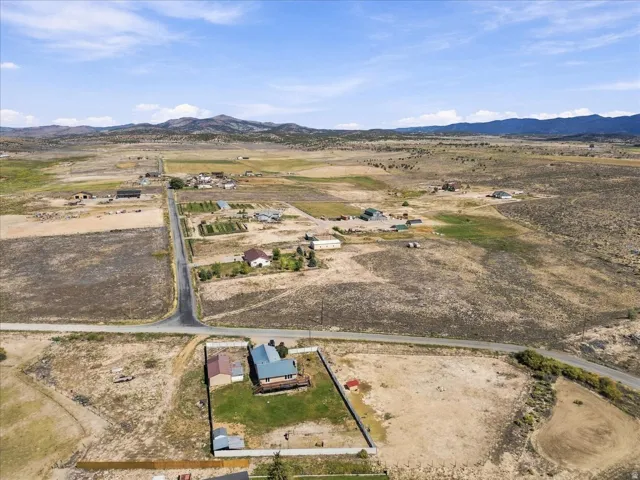 Expansive rural setting with distant mountain backdrops