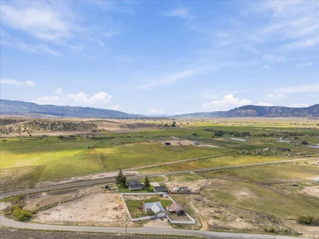 Expansive open land with surrounding mountainous terrain