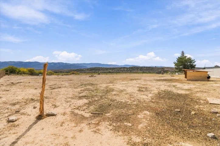 Expansive undeveloped lot with distant mountain terrain