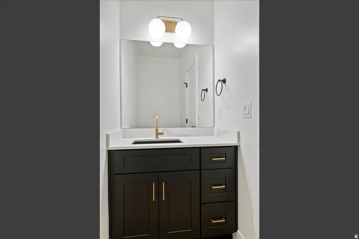 Dark wood-finish vanity with gold-tone hardware