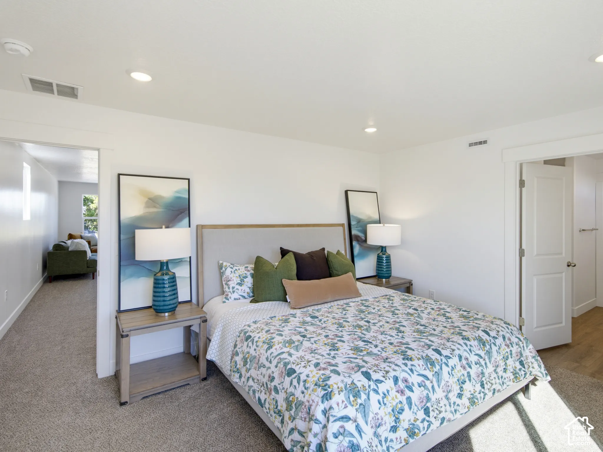 Interior space featuring recessed lighting, wall-to-wall carpeting, and a multi-panel door