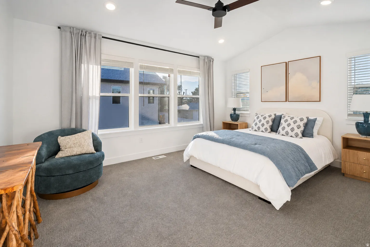 Vaulted ceiling with a ceiling fan, recessed lighting, expansive windows with blinds, and light gray wall-to-wall carpeting