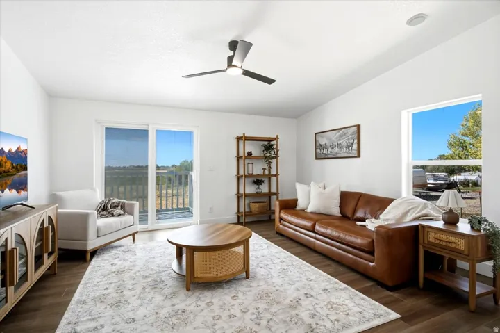 Wood-finish flooring throughout, white walls, and a recessed ceiling light