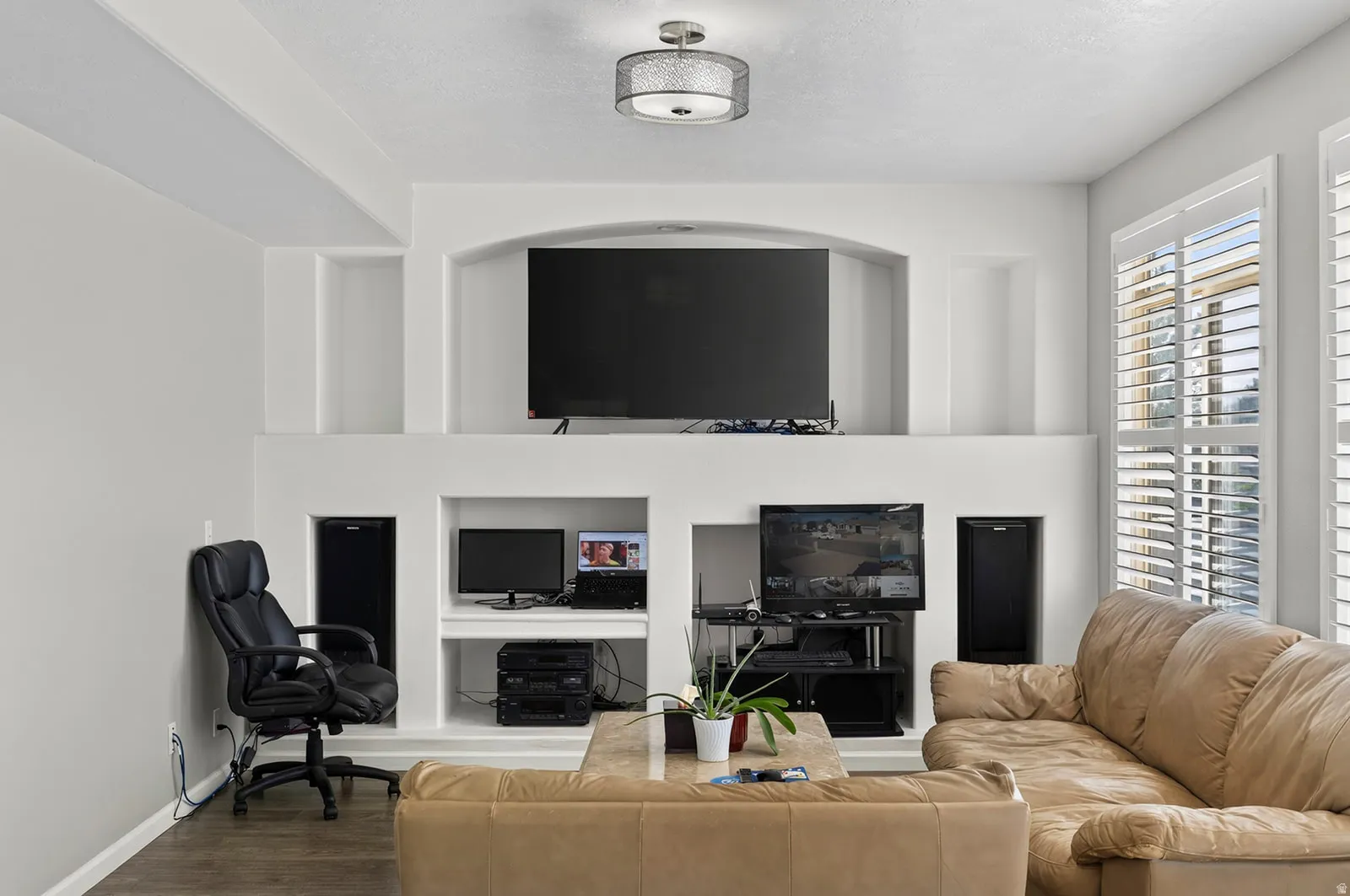 Built-in media center with arched recess and display niches