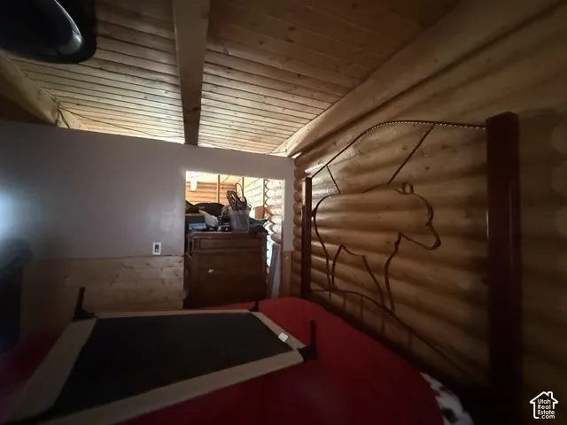 Vaulted wood-paneled ceiling with exposed wood beams