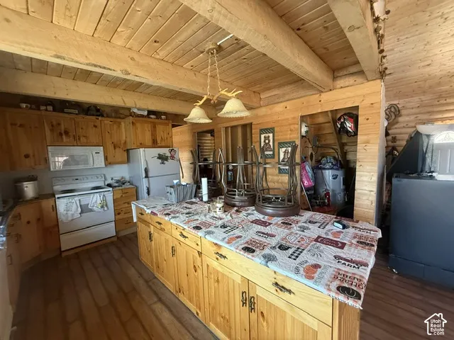 Wood-finish flooring, wood-paneled walls, and wood beam ceiling