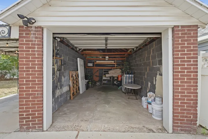 Brick exterior accents framing the garage entrance