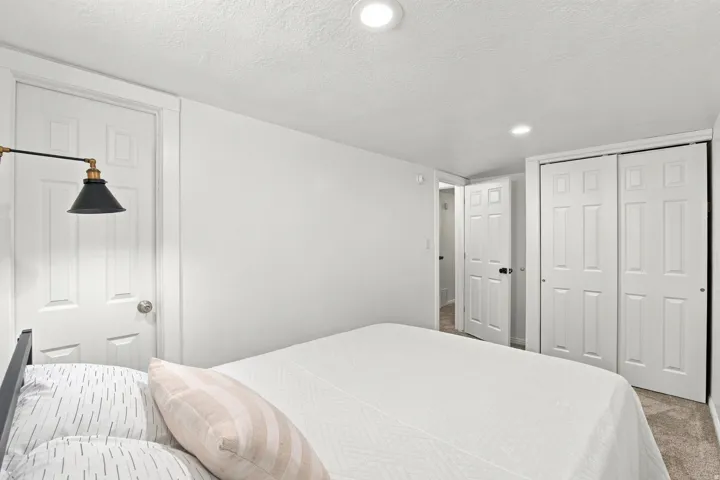 Recessed ceiling lighting, paneled interior doors, and bi-fold closet doors