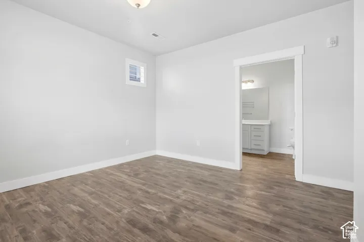 Wood-finish flooring with white trim throughout