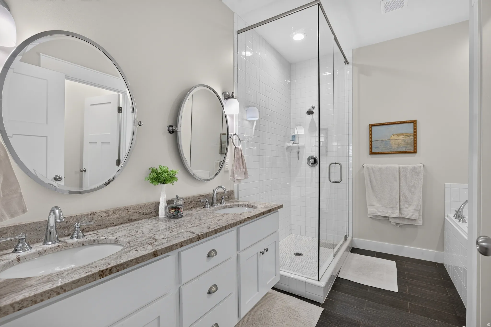 Dual vanity with undermount sinks and a stone-finish countertop