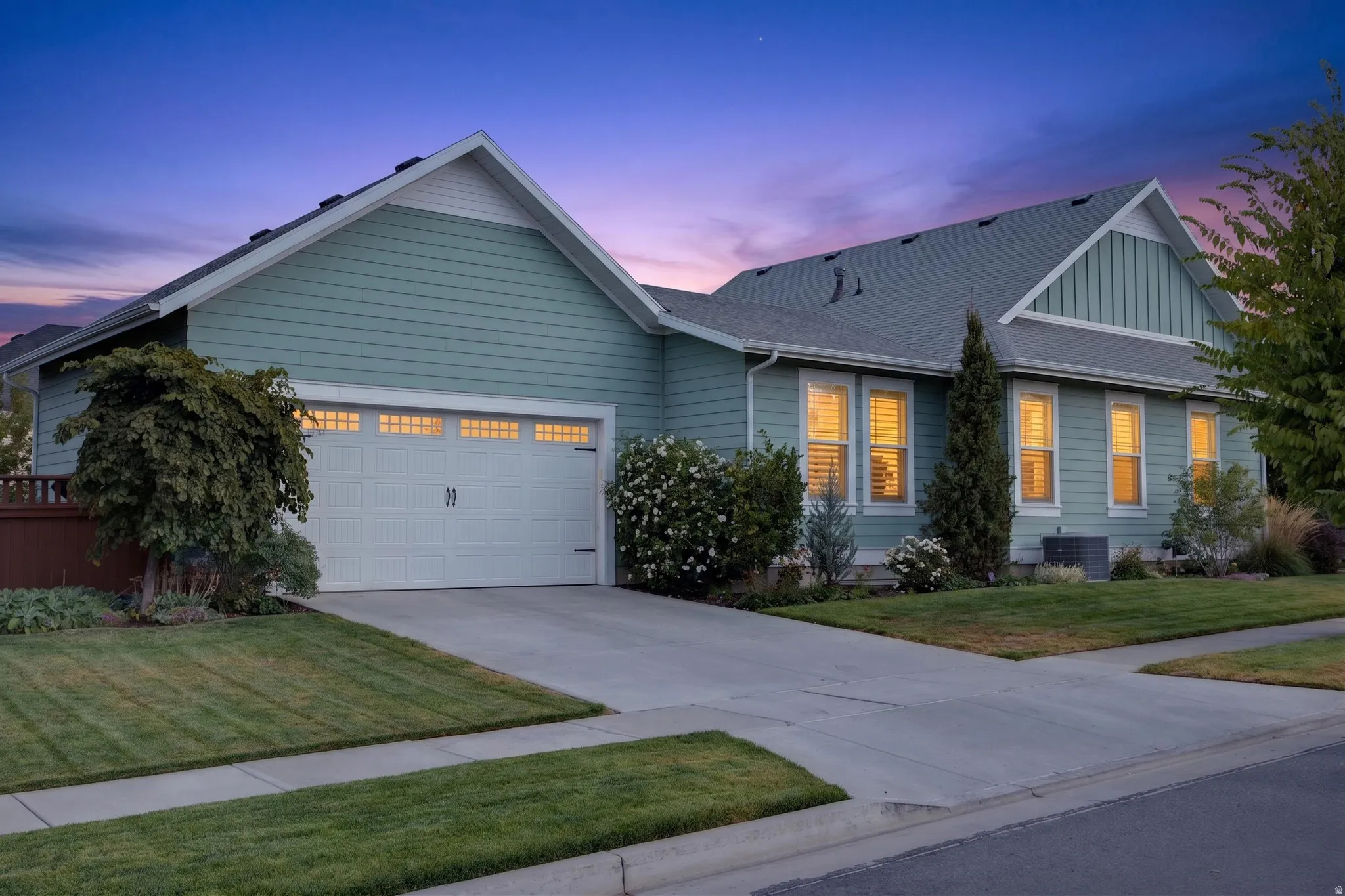 Single-story residence featuring horizontal siding and gabled rooflines