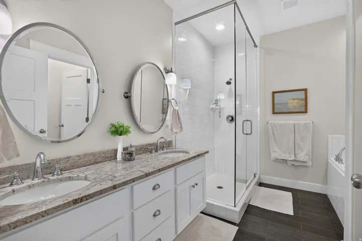 Dual vanity with undermount sinks and a stone-finish countertop