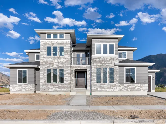 Contemporary exterior featuring stacked stone and horizontal siding