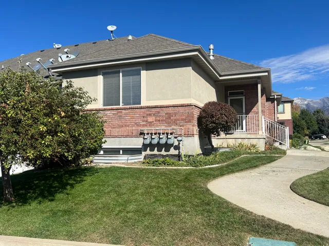 Brick and stucco exterior with a covered porch
