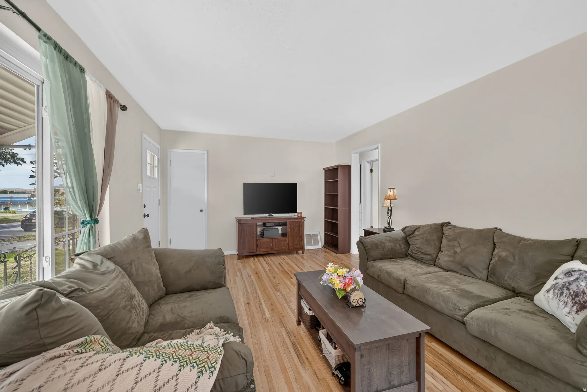 Light neutral wall paint and wood-finish flooring