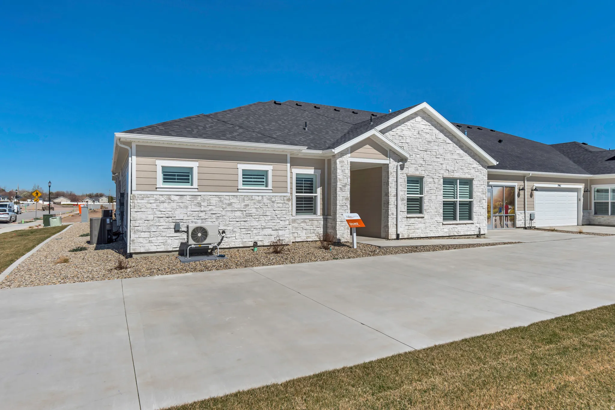Contemporary exterior featuring stone veneer and horizontal siding