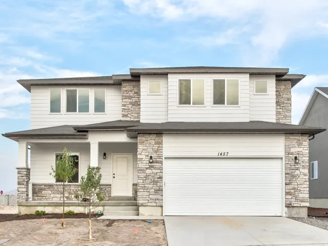 Two-story exterior with stone veneer accents